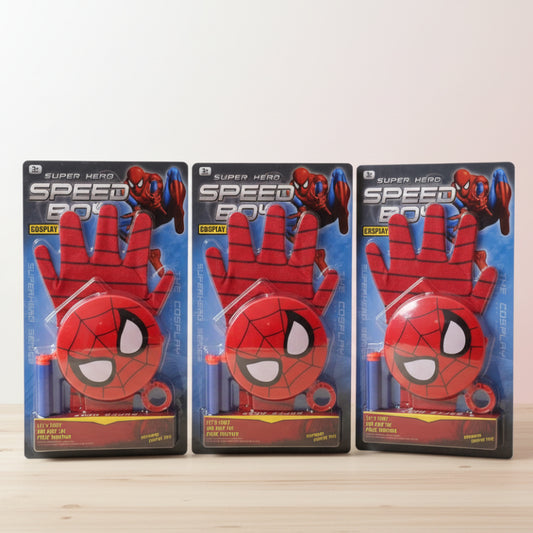 Three Spider-Man cosplay gloves in packaging on a wooden surface with a white wall background.