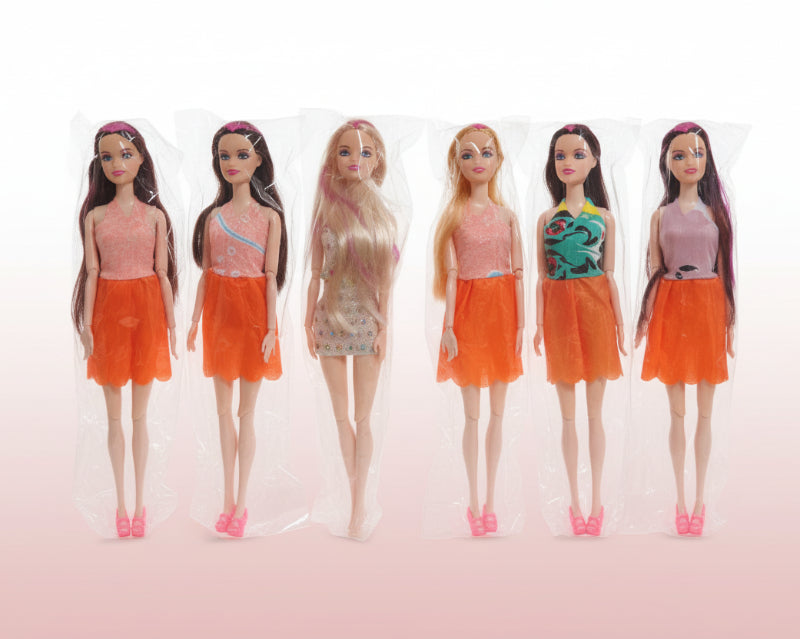 Five Barbie dolls in orange dresses with packaging on a wooden surface.