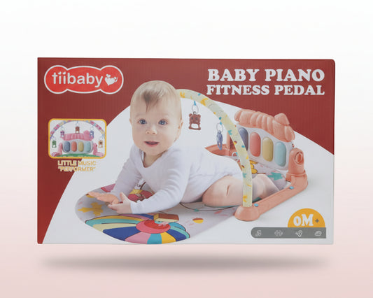 Box of tiibaby baby piano fitness pedal with a baby playing on it.