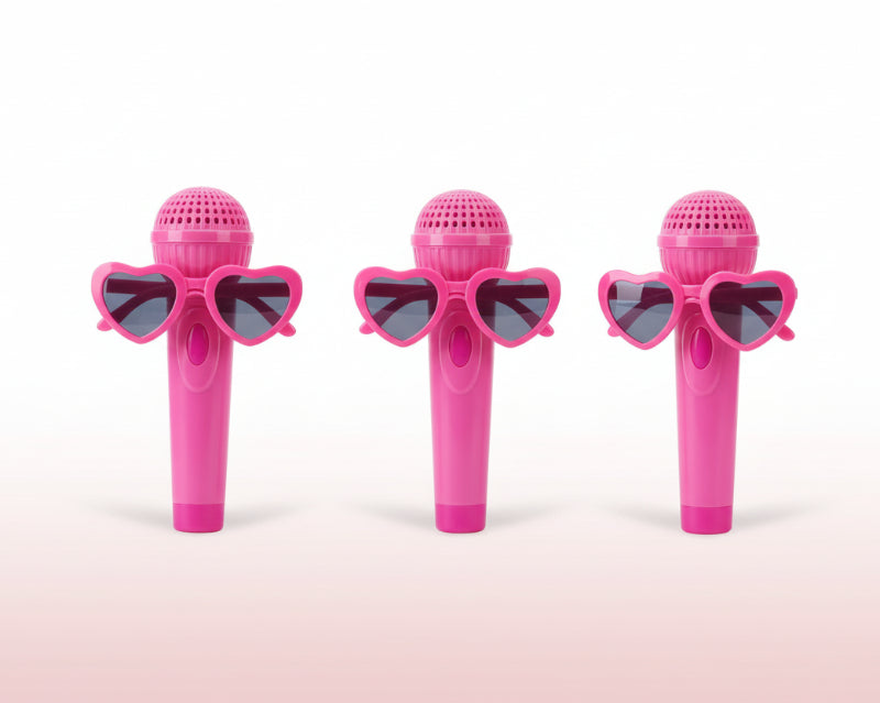 Three toy microphones in packaging featuring different characters on a plain background
