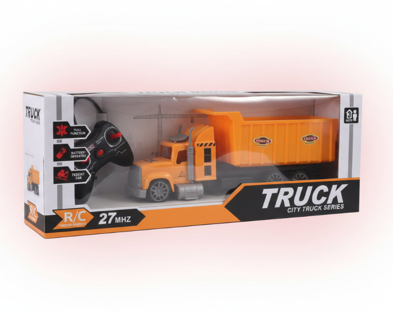 Toy truck packaging with remote control on a wooden surface