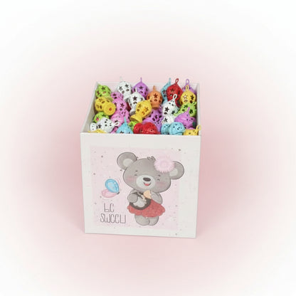 Box of colorful small toys with a bear design on the lid.