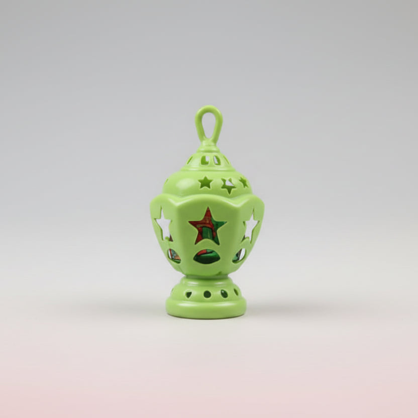 Green decorative lantern on a stick with a blurred background