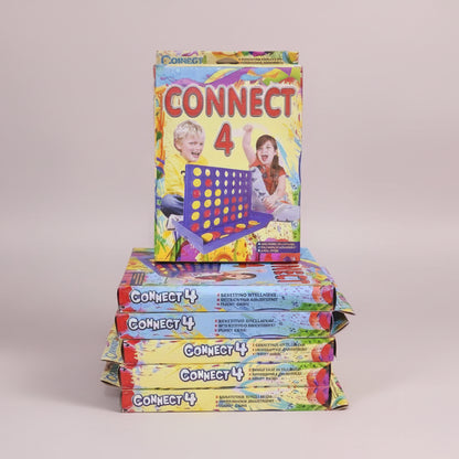 Stack of Connect 4 game boxes with colorful packaging on a wooden surface.