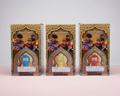 Three boxes with cartoon characters on a wooden surface