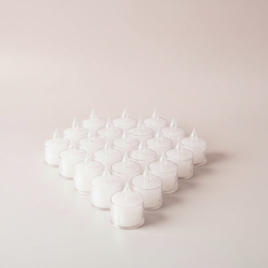 Multiple small clear containers with lids on a wooden surface