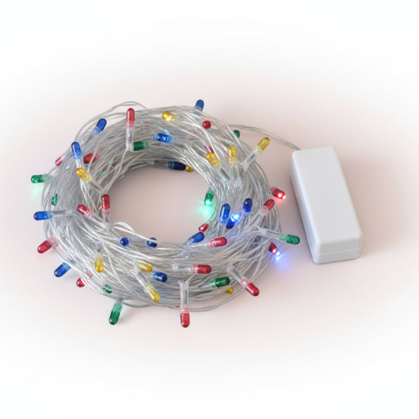 Tangled string of multicolored Christmas lights on a wooden surface