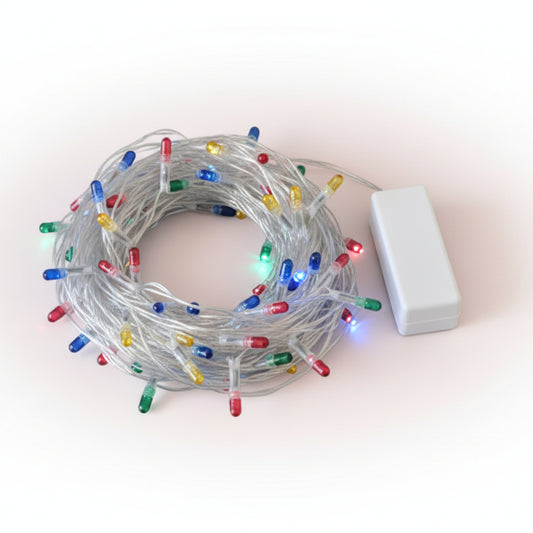 Tangled string of multicolored Christmas lights on a wooden surface