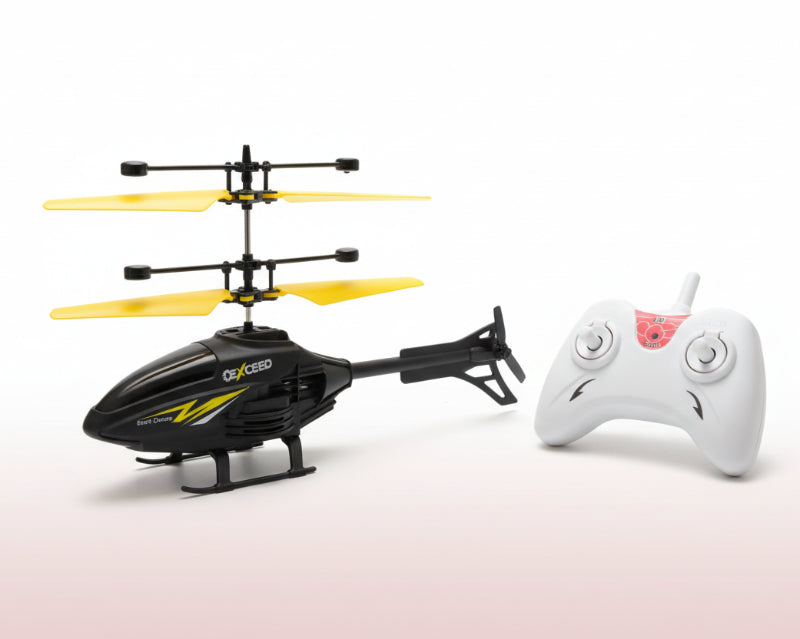 Toy helicopter with remote control and USB cable on a wooden surface