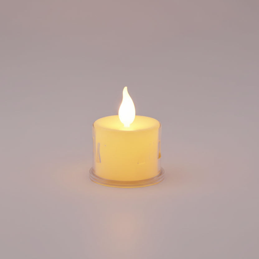 Flickering candle on a wooden surface with a white background