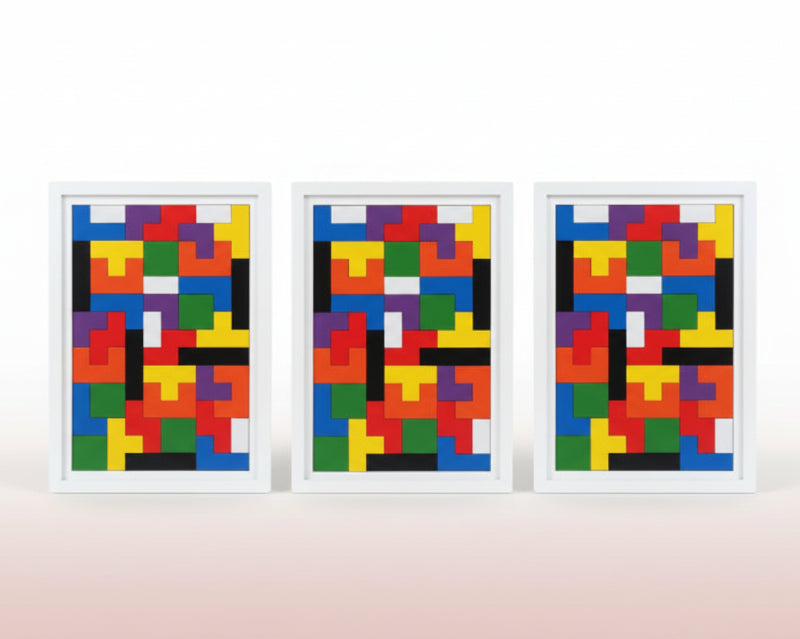 Three wooden puzzle boards with colorful geometric patterns on a wooden surface.