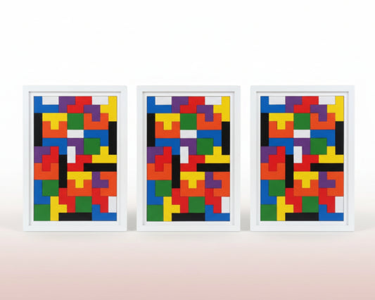 Three wooden puzzle boards with colorful geometric patterns on a wooden surface.