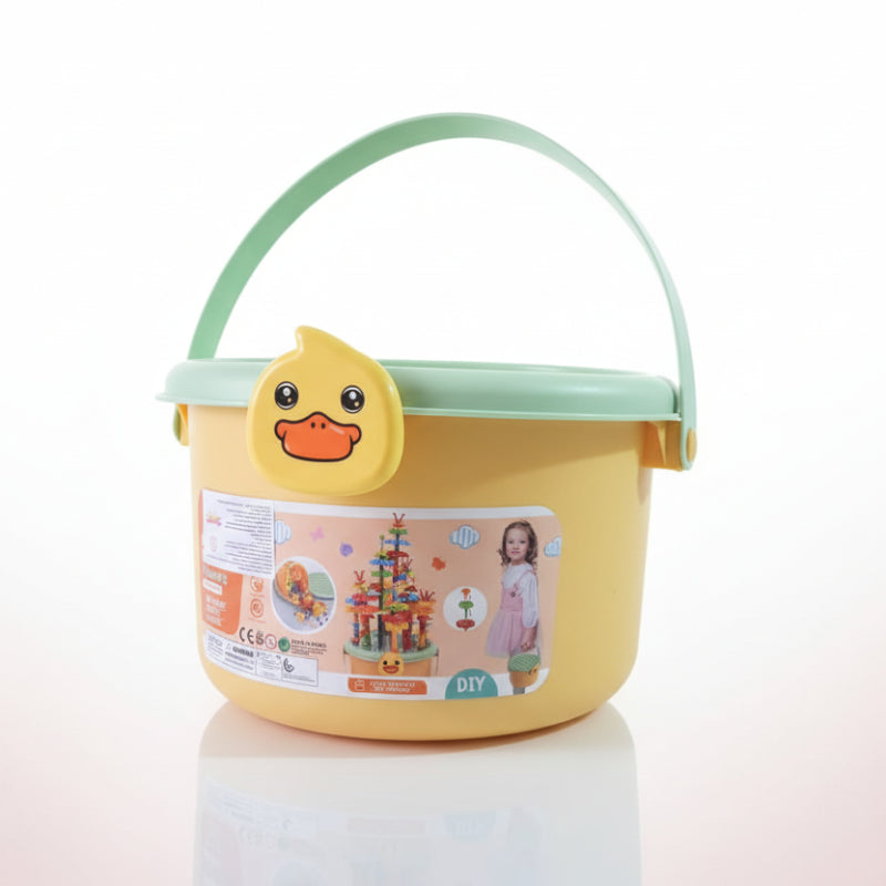 Yellow toy bucket with a duck design on a wooden surface