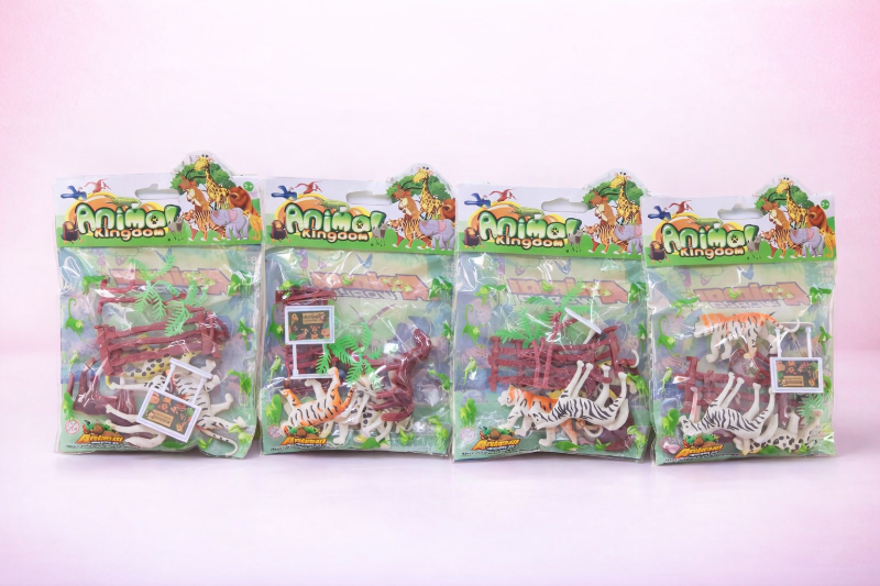 Four packages of 'Animal Kingdom' toys on a pink background