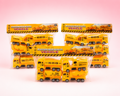 Five packaged yellow toy construction vehicles, including dump trucks and a cement mixer, arranged on a soft pink studio background. Each toy is sealed in clear plastic with a printed header card reading "ENGINEERING VEHICLE.