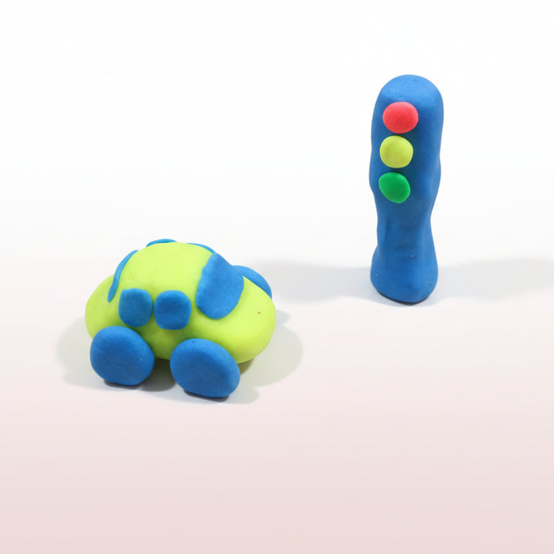 Colorful play-doh creations on a wooden surface