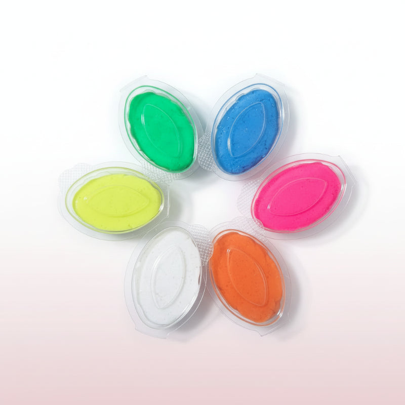 Set of colorful stamp pads on a wooden surface