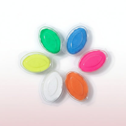 Set of colorful stamp pads on a wooden surface