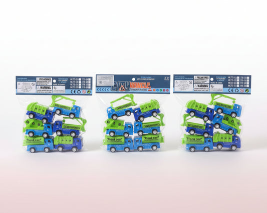 Three packages of toy trucks on a wooden surface with a plain background