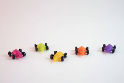 Colorful toy cars on a wooden surface