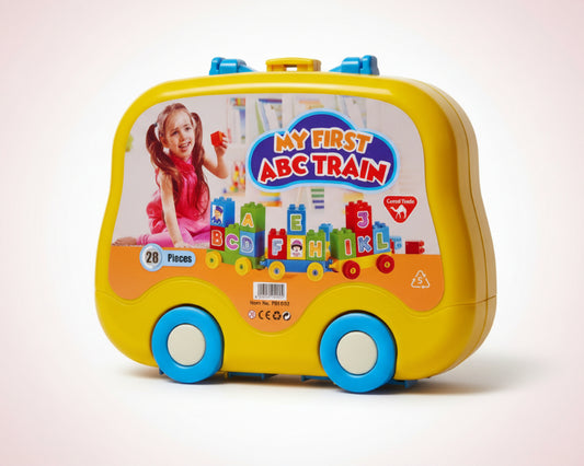 Toy train set packaging with a child and alphabet letters on a yellow background