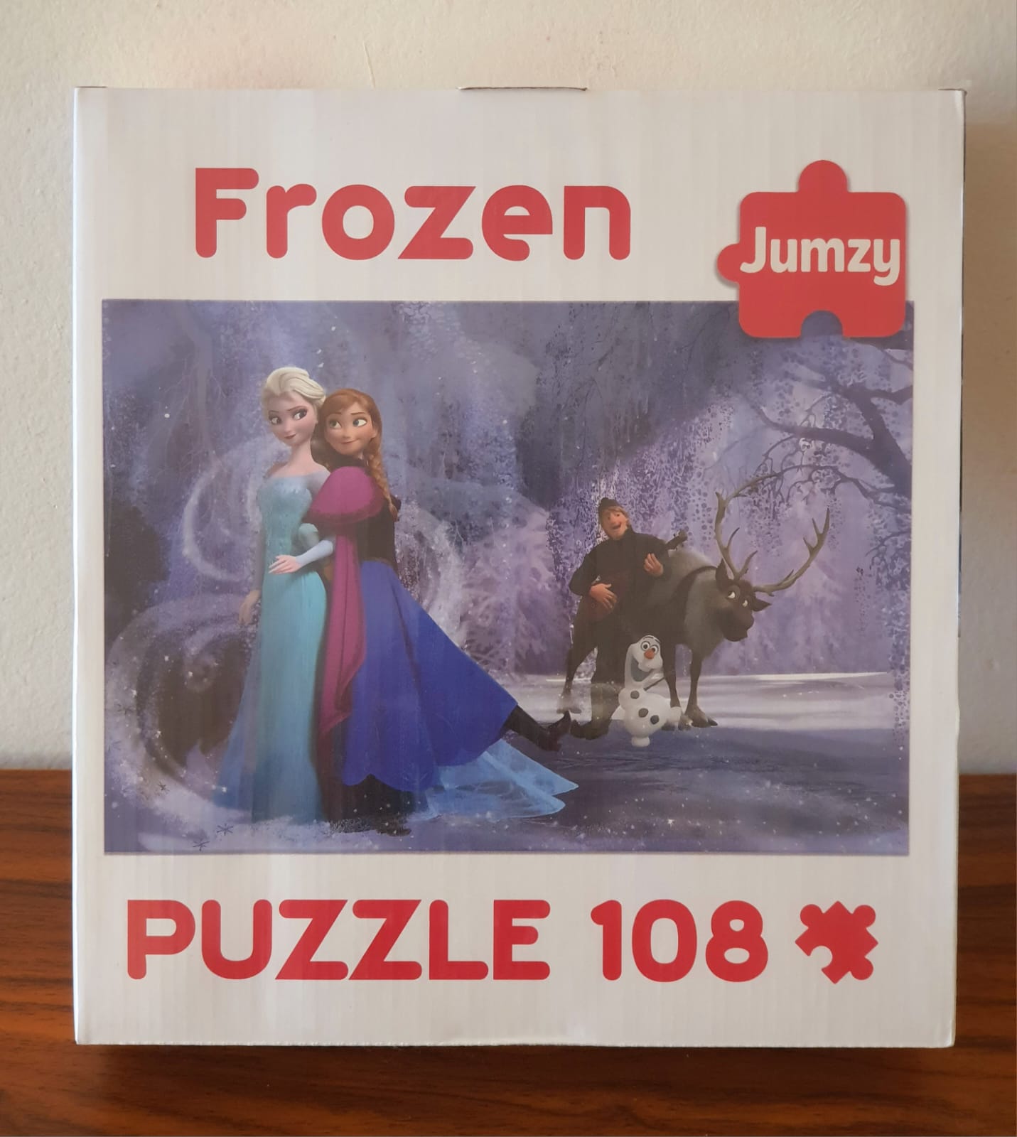 Frozen puzzle box with characters from the movie on a wooden surface