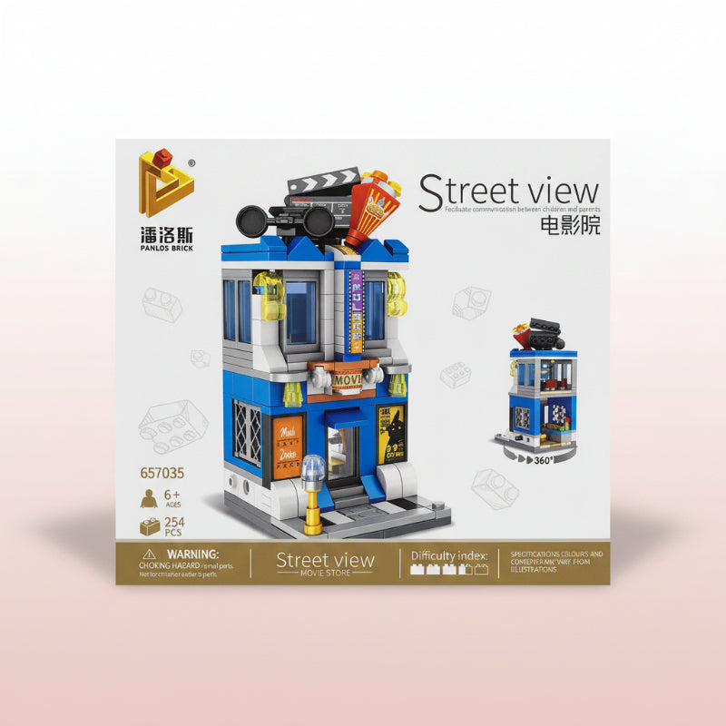 Box of a building block set titled 'Street View' with movie theater design on a wooden surface.