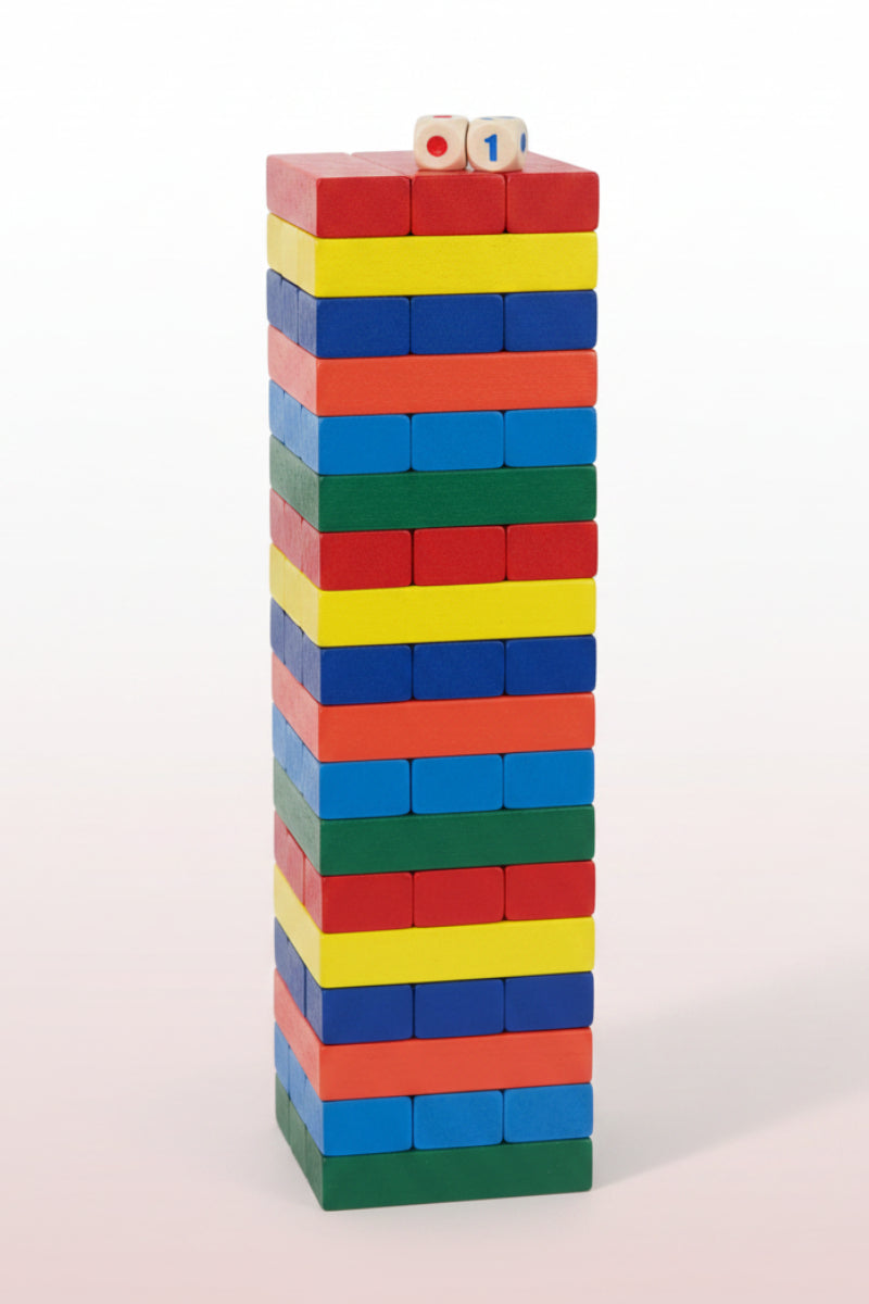 Stack of colorful building blocks on a wooden surface with a white background