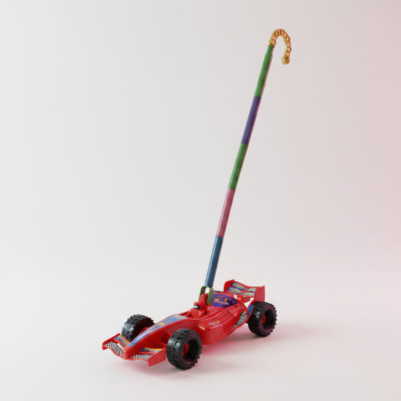 Toy lawn mower with colorful design on a wooden surface