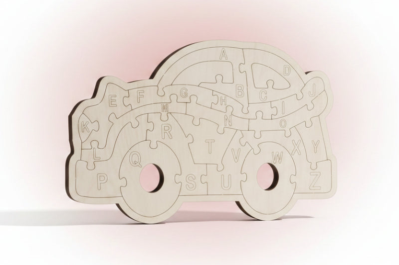 Wooden puzzle shaped like a car with alphabet letters on a black background