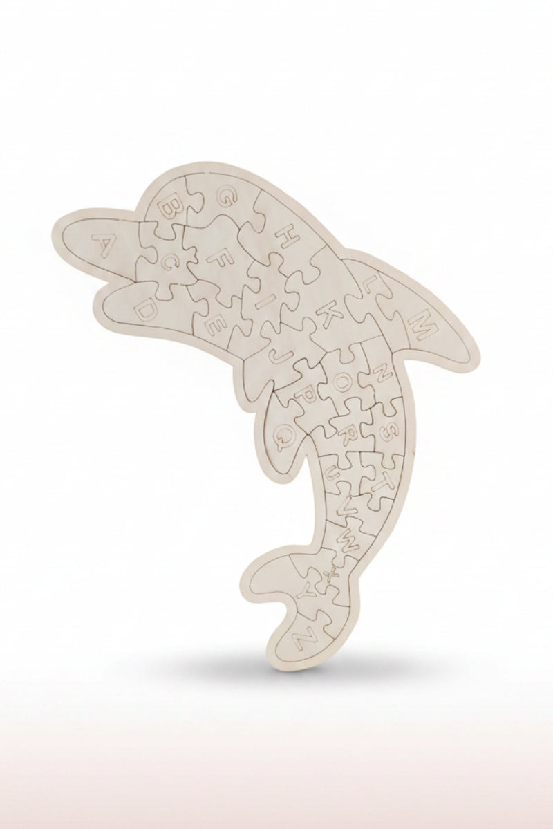 Dolphin-shaped jigsaw puzzle on a reflective surface with a dark background