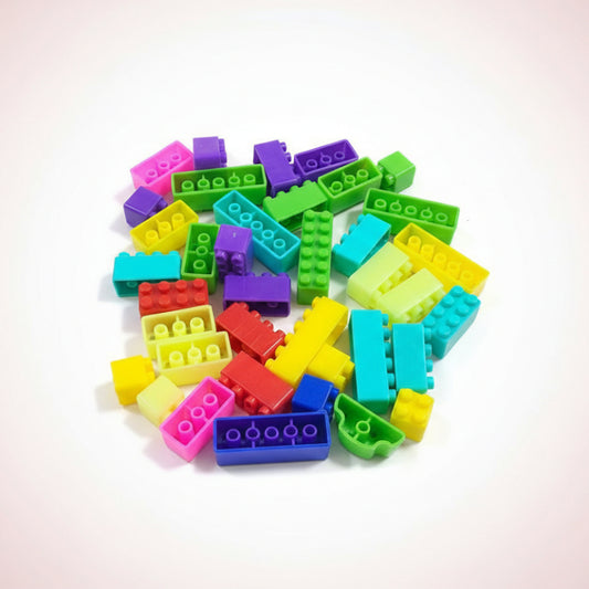 Colorful building blocks scattered on a wooden surface